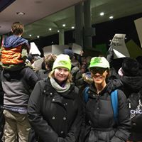 A photo of two people wearing legal observer hats